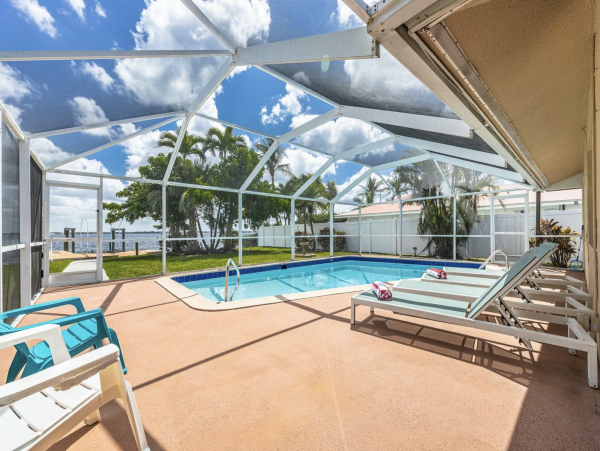Cape Coral Four Bedroom Luxury Retreat with Caged Pool