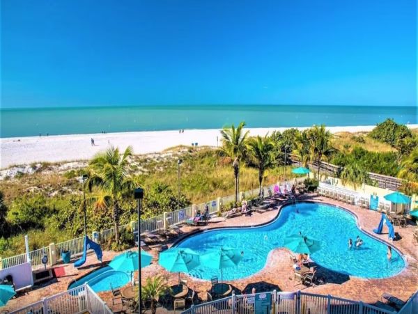 BeachFront Two Bedroom Vacation Condo w/ Heated Resort Pool