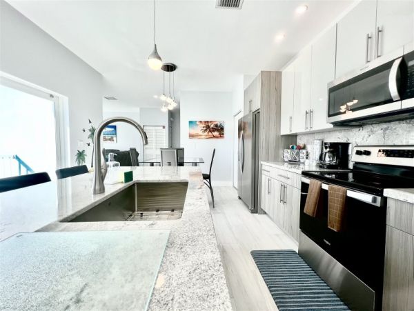 Waterfront 4 Bedroom Vacation Rental with Dock & Pool