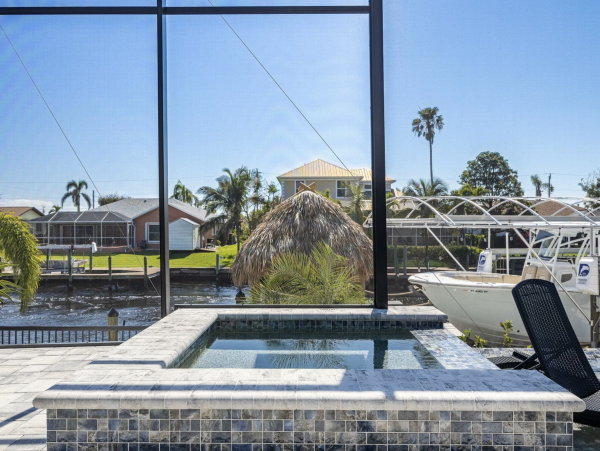 Canal Front 3 Bedroom + Kids Room Home with Pool-Spa & Boat Dock in Cape Coral