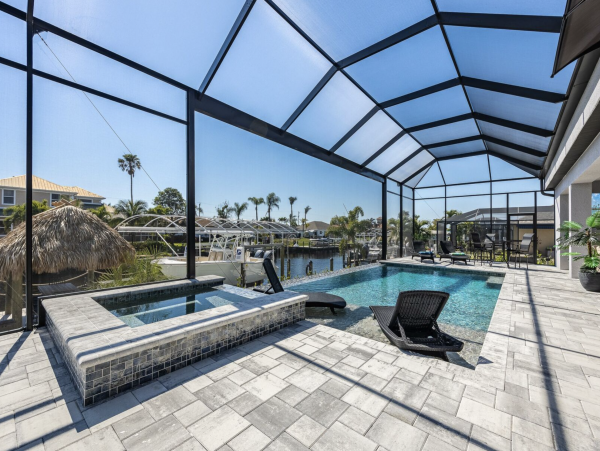 Canal Front 3 Bedroom + Kids Room Home with Pool-Spa & Boat Dock in Cape Coral