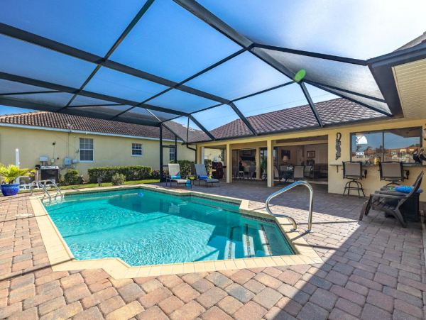 Canal Front Retreat with Gulf Access, Pool, and Tiki Dock in Cape Coral