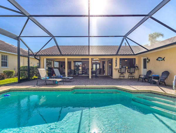 Canal Front Retreat with Gulf Access, Pool, and Tiki Dock in Cape Coral