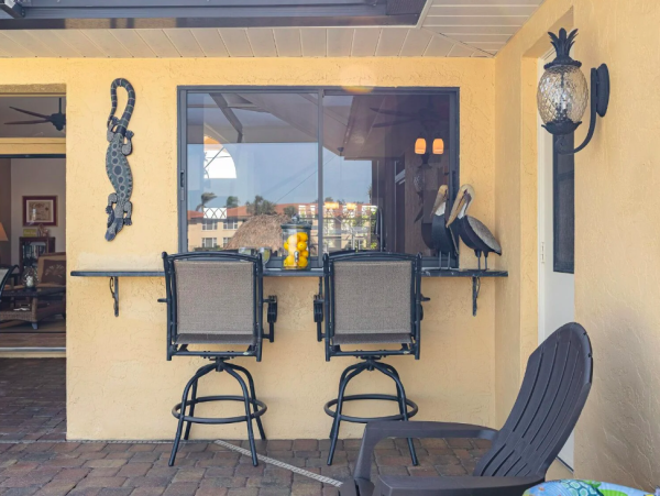 Canal Front Retreat with Gulf Access, Pool, and Tiki Dock in Cape Coral