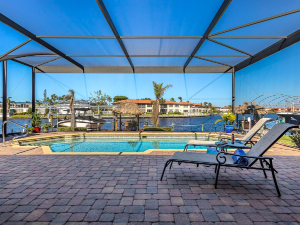 Canal Front Retreat with Gulf Access, Pool, and Tiki Dock in Cape Coral