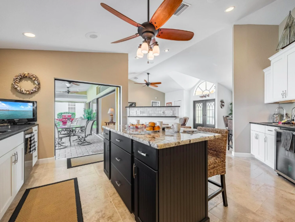 Canal Front Retreat with Gulf Access, Pool, and Tiki Dock in Cape Coral