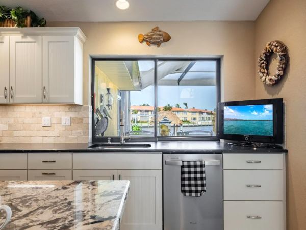 Canal Front Retreat with Gulf Access, Pool, and Tiki Dock in Cape Coral