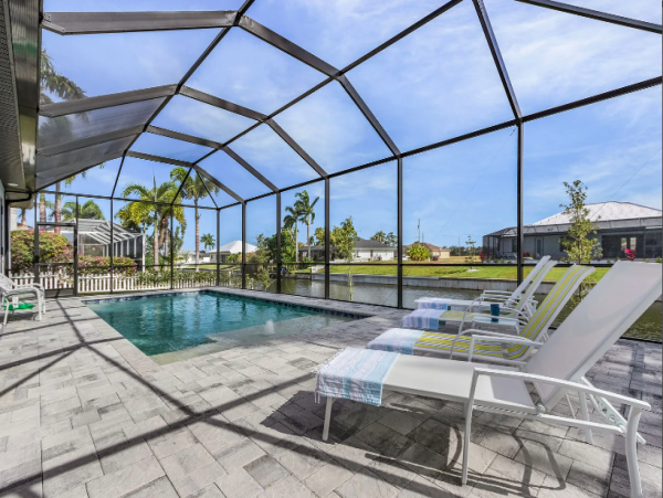 Cape Coral Coastal Elegance Retreat with Caged Pool and Scenic Views