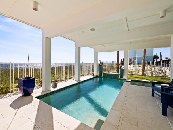 Luxurious Beachfront Retreat with Pool, Direct Access to Beach, and Exclusive Amenities
