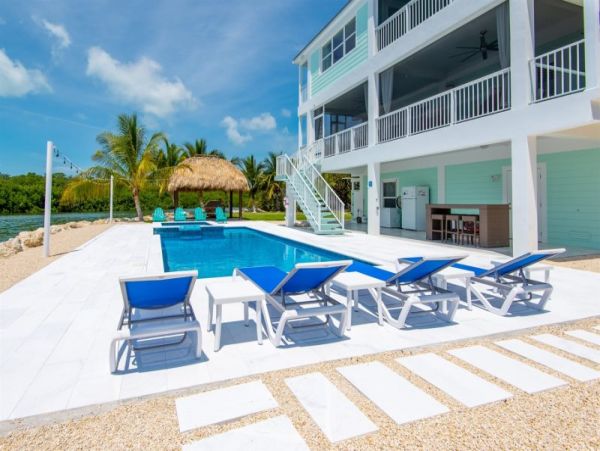 Breathtaking Waterfront Escape with Pool, Tiki Bar & Boat Ramp at Coco Plum