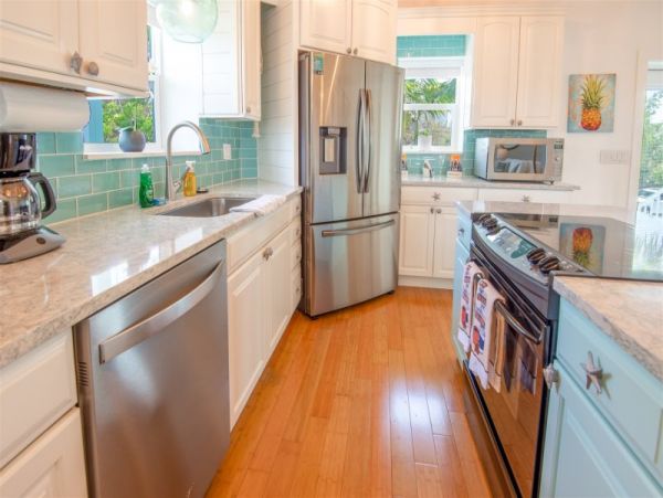 Breathtaking Waterfront Escape with Pool, Tiki Bar & Boat Ramp at Coco Plum