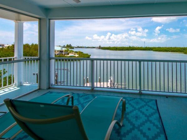 Breathtaking Waterfront Escape with Pool, Tiki Bar & Boat Ramp at Coco Plum