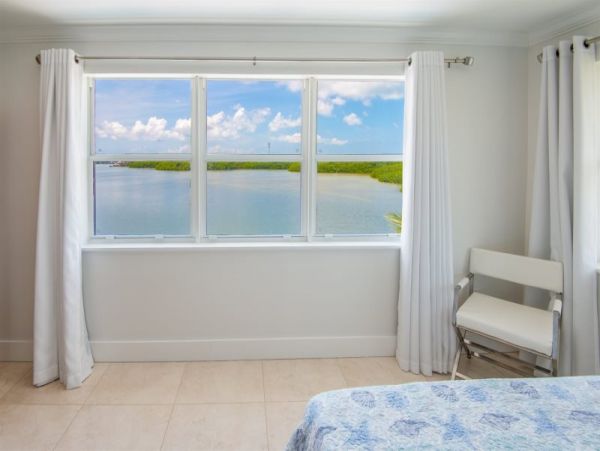 Breathtaking Waterfront Escape with Pool, Tiki Bar & Boat Ramp at Coco Plum