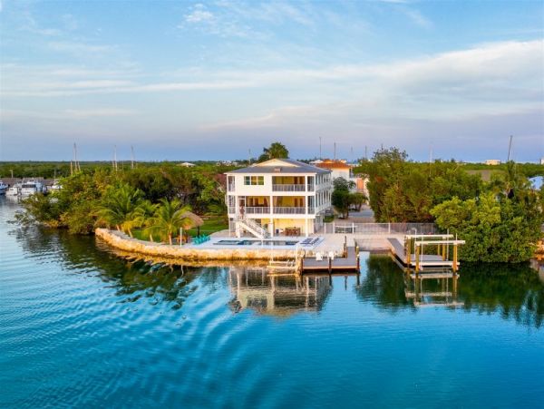 Breathtaking Waterfront Escape with Pool, Tiki Bar & Boat Ramp at Coco Plum