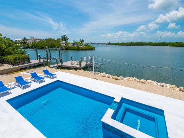 Breathtaking Waterfront Escape with Pool, Tiki Bar & Boat Ramp at Coco Plum