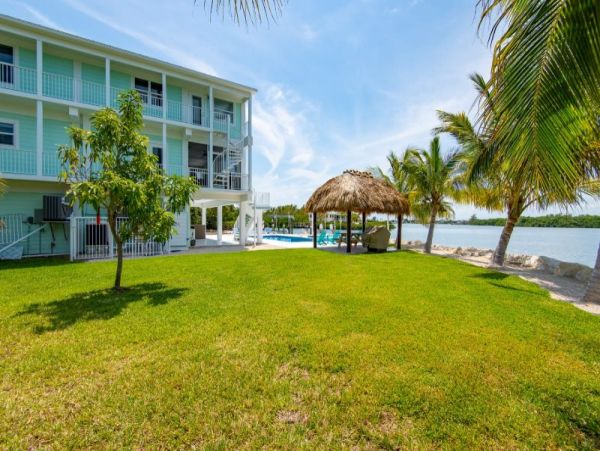 Breathtaking Waterfront Escape with Pool, Tiki Bar & Boat Ramp at Coco Plum