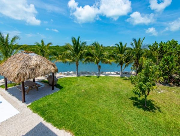 Breathtaking Waterfront Escape with Pool, Tiki Bar & Boat Ramp at Coco Plum