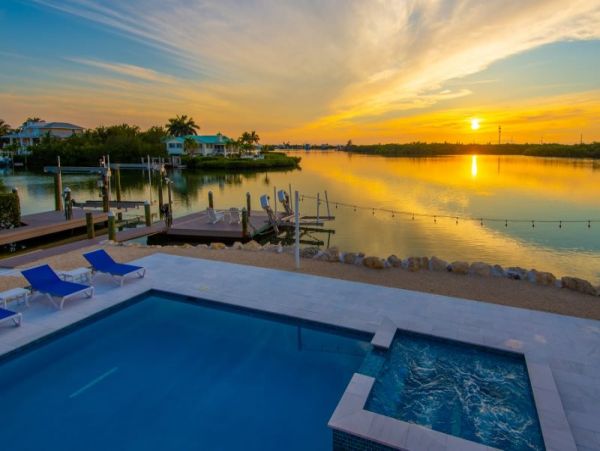 Breathtaking Waterfront Escape with Pool, Tiki Bar & Boat Ramp at Coco Plum