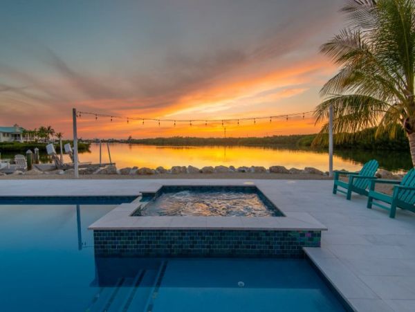 Breathtaking Waterfront Escape with Pool, Tiki Bar & Boat Ramp at Coco Plum