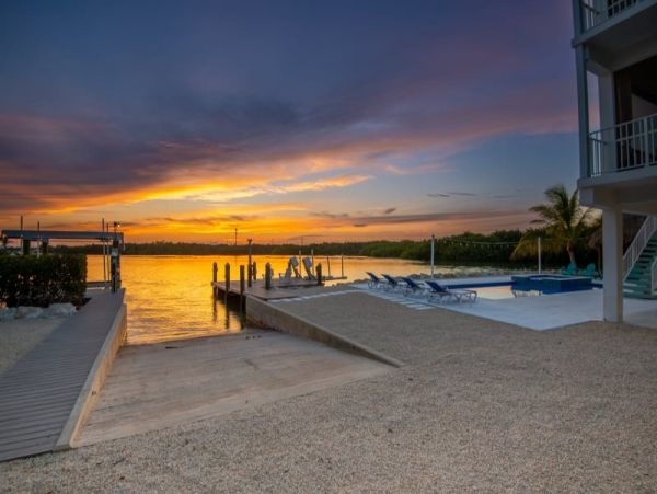 Breathtaking Waterfront Escape with Pool, Tiki Bar & Boat Ramp at Coco Plum