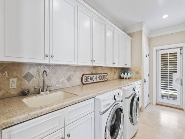 Incredible Luxury Home with Pool in a Gated Gulf Front Community