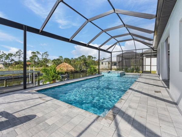Luxury Canal Front Home with Caged Pool in Cape Coral