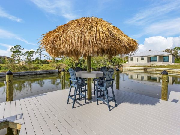 Luxury Canal Front Home with Caged Pool in Cape Coral