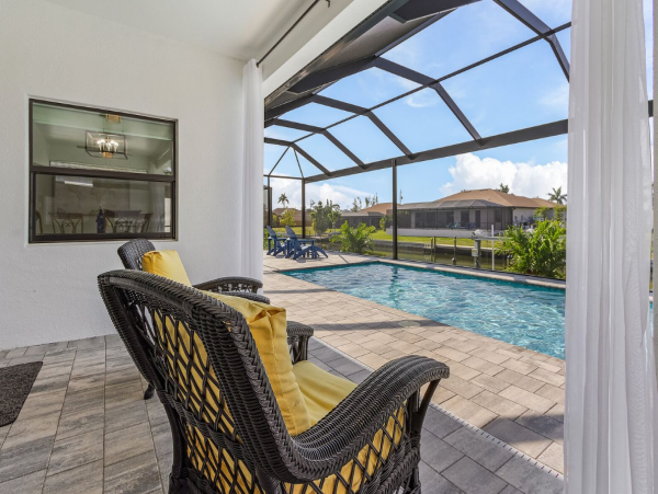 Luxury Canal Front Home with Caged Pool in Cape Coral