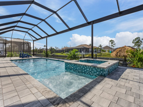 Luxury Canal Front Home with Caged Pool in Cape Coral