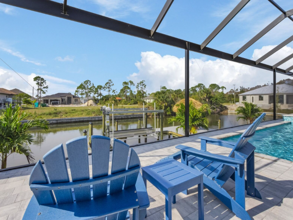 Luxury Canal Front Home with Caged Pool in Cape Coral