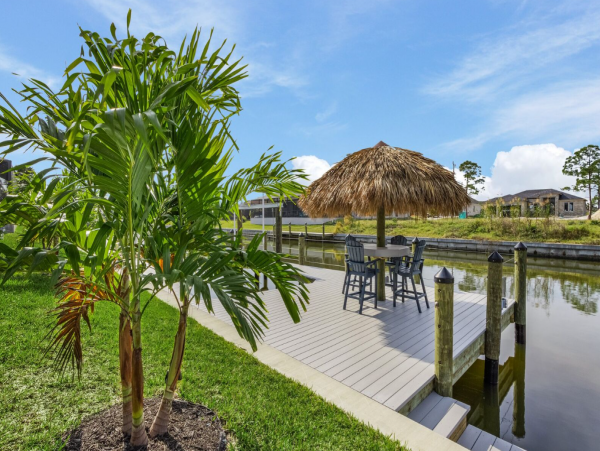 Luxury Canal Front Home with Caged Pool in Cape Coral