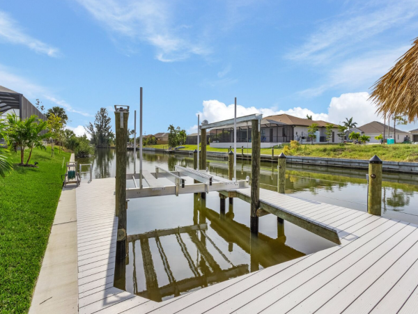 Luxury Canal Front Home with Caged Pool in Cape Coral