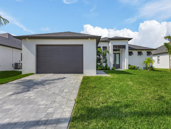 Luxury Canal Front Home with Caged Pool in Cape Coral