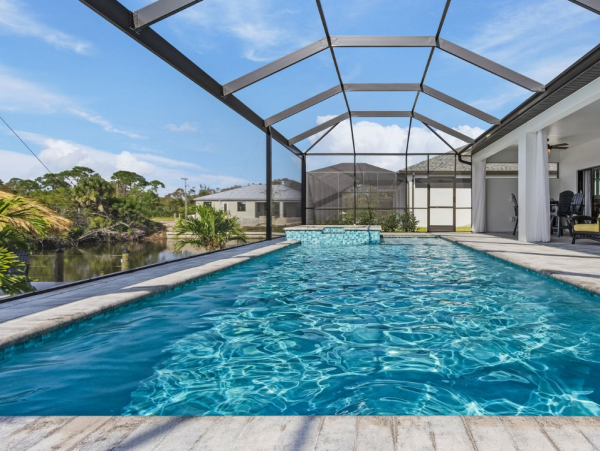 Luxury Canal Front Home with Caged Pool in Cape Coral