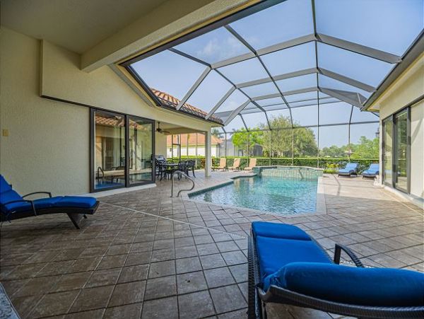 Naples Four Bedroom Vacation Rental with Caged Pool and Lake View