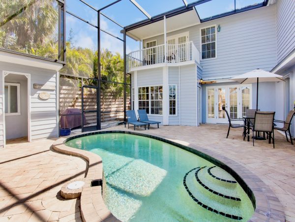 Siesta Key Vacation Rental Luxury 4-Bedroom Canal-Front Home with Pool & Dock