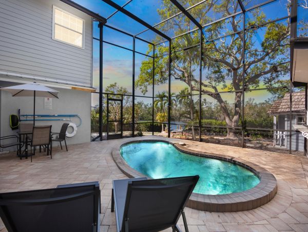 Siesta Key Vacation Rental Luxury 4-Bedroom Canal-Front Home with Pool & Dock