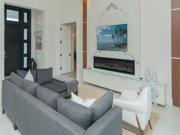 Luxurious Coastal Retreat - 4-Bedroom Waterfront Home with Pool, Theater, and Fitness Room