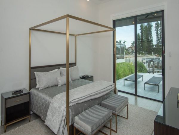 Luxurious Coastal Retreat - 4-Bedroom Waterfront Home with Pool, Theater, and Fitness Room