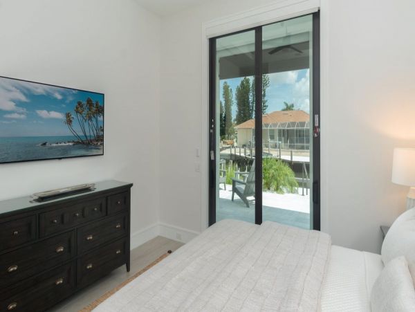 Luxurious Coastal Retreat - 4-Bedroom Waterfront Home with Pool, Theater, and Fitness Room