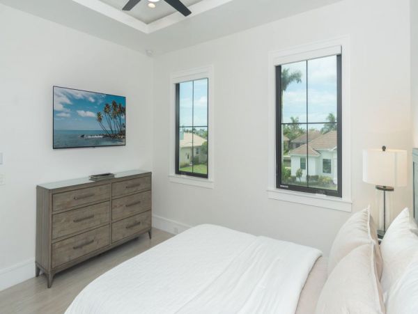 Luxurious Coastal Retreat - 4-Bedroom Waterfront Home with Pool, Theater, and Fitness Room