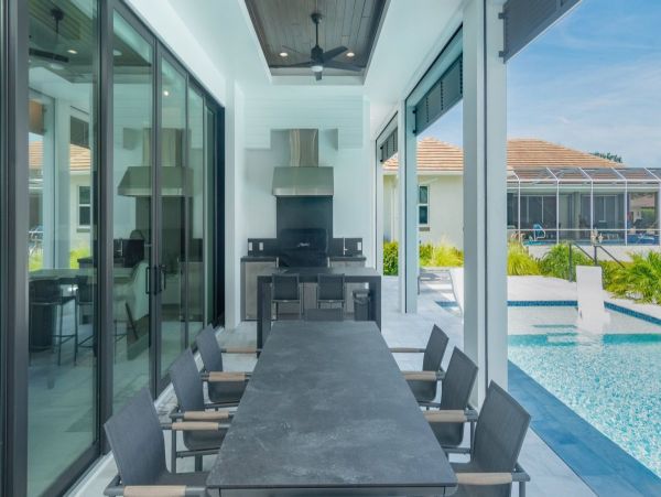 Luxurious Coastal Retreat - 4-Bedroom Waterfront Home with Pool, Theater, and Fitness Room