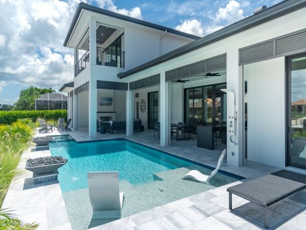 Luxurious Coastal Retreat - 4-Bedroom Waterfront Home with Pool, Theater, and Fitness Room