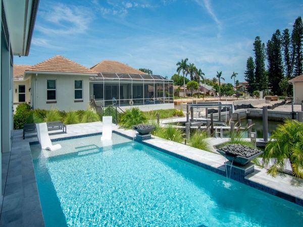 Luxurious Coastal Retreat - 4-Bedroom Waterfront Home with Pool, Theater, and Fitness Room