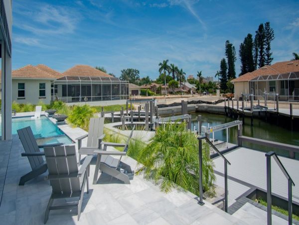 Luxurious Coastal Retreat - 4-Bedroom Waterfront Home with Pool, Theater, and Fitness Room