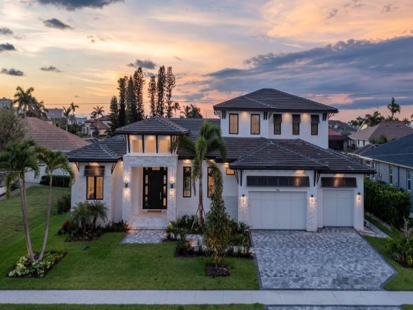 Luxurious Coastal Retreat - 4-Bedroom Waterfront Home with Pool, Theater, and Fitness Room