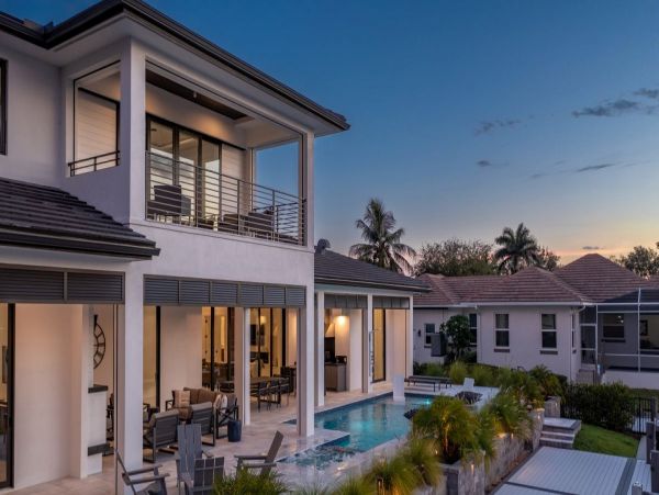 Luxurious Coastal Retreat - 4-Bedroom Waterfront Home with Pool, Theater, and Fitness Room