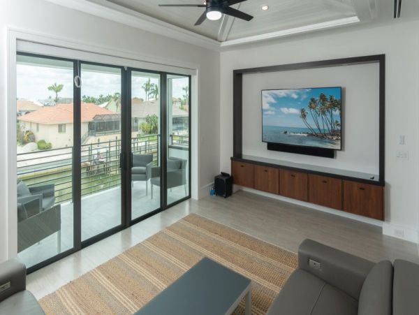 Luxurious Coastal Retreat - 4-Bedroom Waterfront Home with Pool, Theater, and Fitness Room