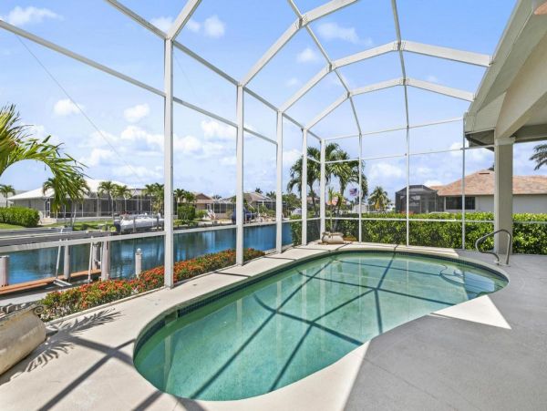 Waterfront Retreat with Private Caged Pool in Marco Island