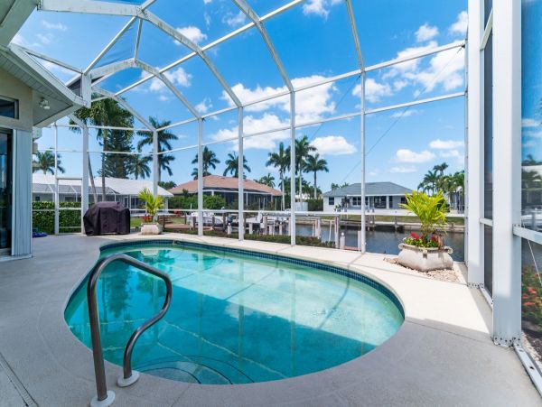 Waterfront Retreat with Private Caged Pool in Marco Island